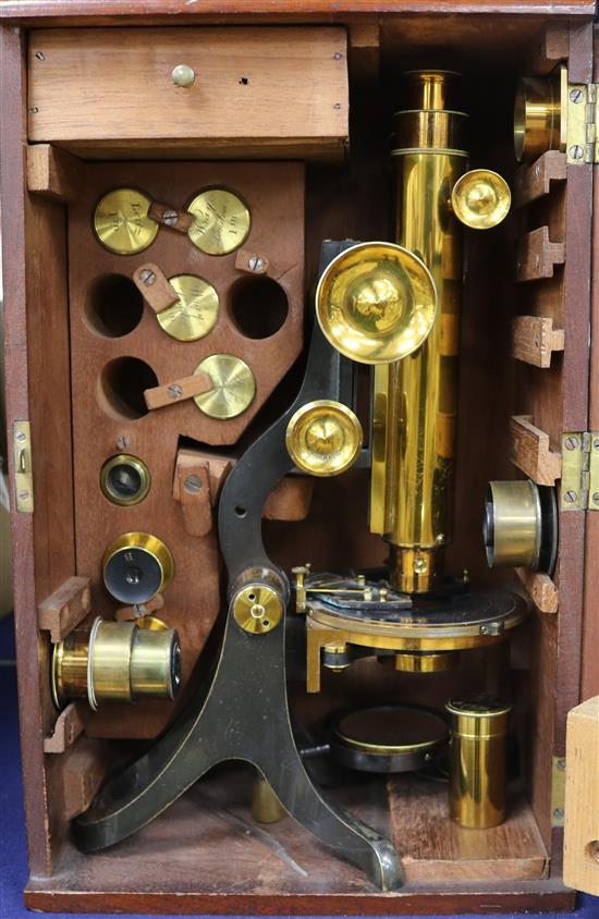 A Henry Crouch compound binocular microscope, early 20th century, height 14ins., in a mahogany case.